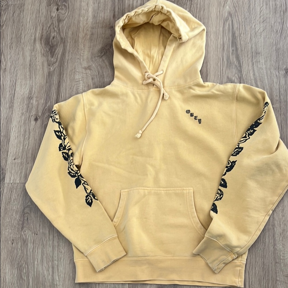 Yellow Hoodie with Black Floral Design by OBEY medium
